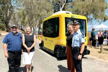 ISLAND TRIP: Cr Mark Edwards and Mayor Karen Williams (left) on Karragarra Island with the RACQ driverless bus. Photo: supplied
