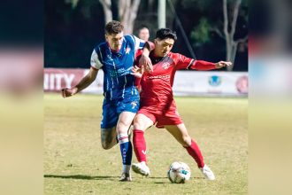 TUSSLE: Ryo Emoto battles for the ball during the Red Devils NPL Men’s clash against Peninsula Power at Cleveland. Photo: Ray Gardner