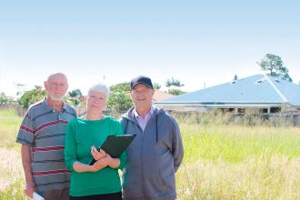 STANDING THEIR GROUND: John Watts with neighbours Rhonda and David Lamont