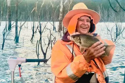 ALL SMILES: Raymond Kennedy with a bass caught at Lake Hinze.