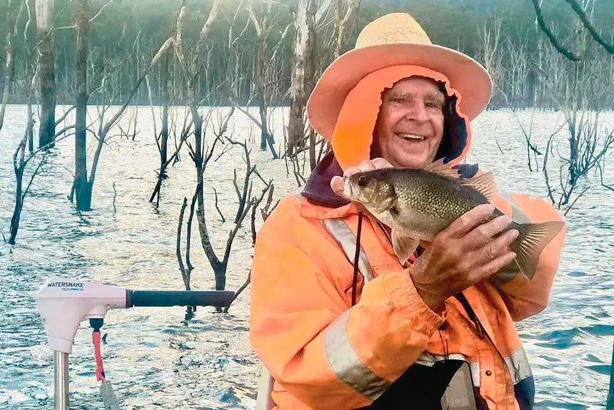 ALL SMILES: Raymond Kennedy with a bass caught at Lake Hinze.