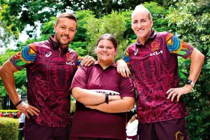 LEADING THE WAY: Broncos representatives Scott Prince and Ali Brigginshaw with Cleveland District State High School student Anika Anderson (centre).