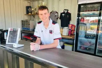 NEW DIGS: Under 14 player Nicolas Monck works the canteen at Redland City FC.