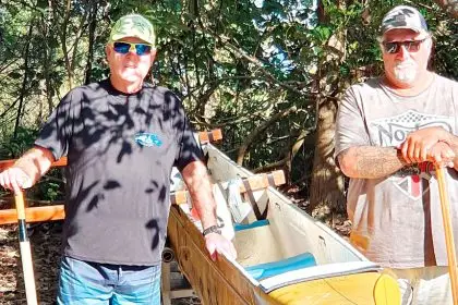 OUTDOOR LIFESTYLE: Peter Hayward and Noel Turpin with an outrigger canoe.