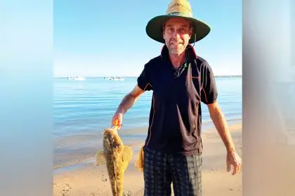 SIZEABLE CATCH: Tom Darton with a flathead caught during a successful afternoon of fishing.