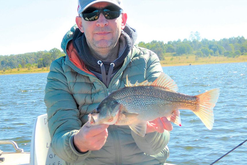 SUCCESSFUL OUTING: Mark Masters with a bass caught at North Pine Dam.