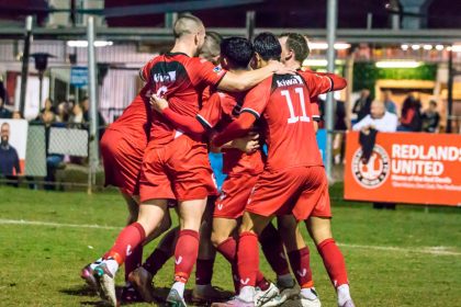 TEAM SPIRIT: Redlands United celebrate Jack Skinner’s goal in the Australia Cup clash against Lions FC. Photo: Ray Gardner