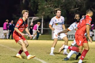 TOP PERFORMANCE: Redlands man of the match Jack Skinner feeds the ball through the defensive line for Guil Santana.