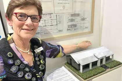 LOOKING AHEAD: Janese Lowe with a miniature replica of the future U3A building.