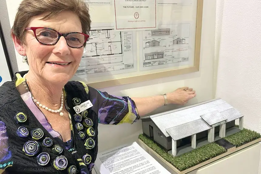 LOOKING AHEAD: Janese Lowe with a miniature replica of the future U3A building.