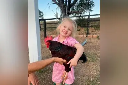 ALL SMILES: Rose Turnbull shares her excitement about some wins at this year’s Ekka with her Rhode Island red.