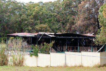 DEVASTATION: The scene of a fatal house fire on Russell Island, where police are carrying out an investigation. Photo: Russell Freeman/AAP Images
