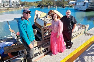 KEEPING IT CLEAN: Ocean Crusaders founder and general manager Ian Thomson meets with councillors Julie Talty and Mark Edwards at Weinam Creek to show them the debris collected by volunteers.