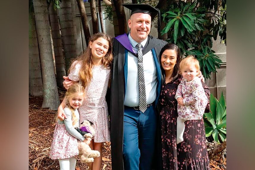 FAMILY: Law graduate Deacon Johnston with his wife and three daughters.