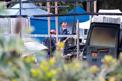 TRAGEDY: Investigators at the scene of a blaze that killed Wayne Godinet and his five boys. Photo: Rusell Freeman/AAP Images