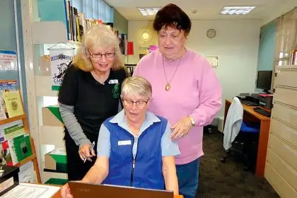 UPGRADE: Redland Genealogical Society members Karen Hawkes, Annette Hall and Margaret Clark enjoying the new Laptop.