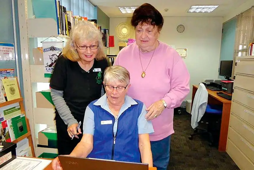 UPGRADE: Redland Genealogical Society members Karen Hawkes, Annette Hall and Margaret Clark enjoying the new Laptop.