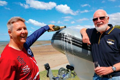 CELEBRATION: Steve Lawie and Brian Russell launch Cleveland Yacht Club’s new boat.