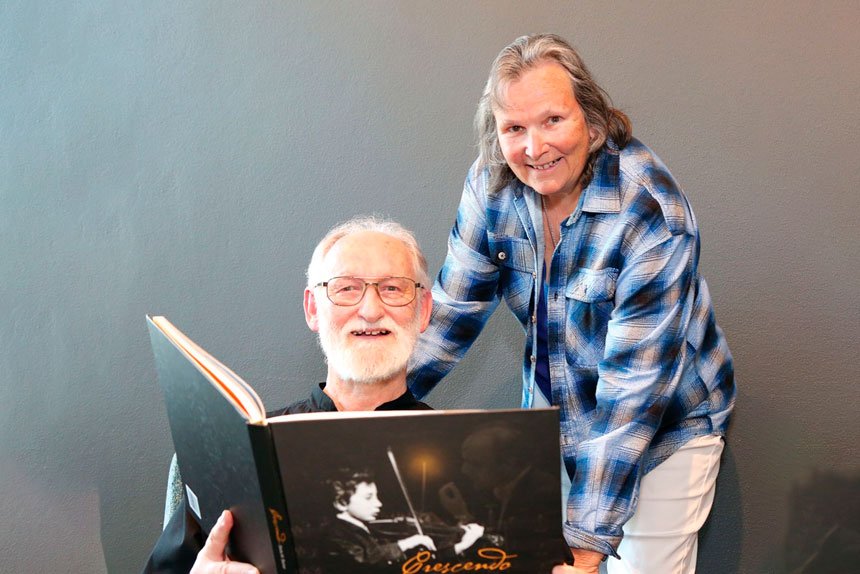 GIFT: Sinfonia conductor Graeme Dennis receives music memorabilia from Eva Degen, daughter of composer and writer Jindrich Degen.