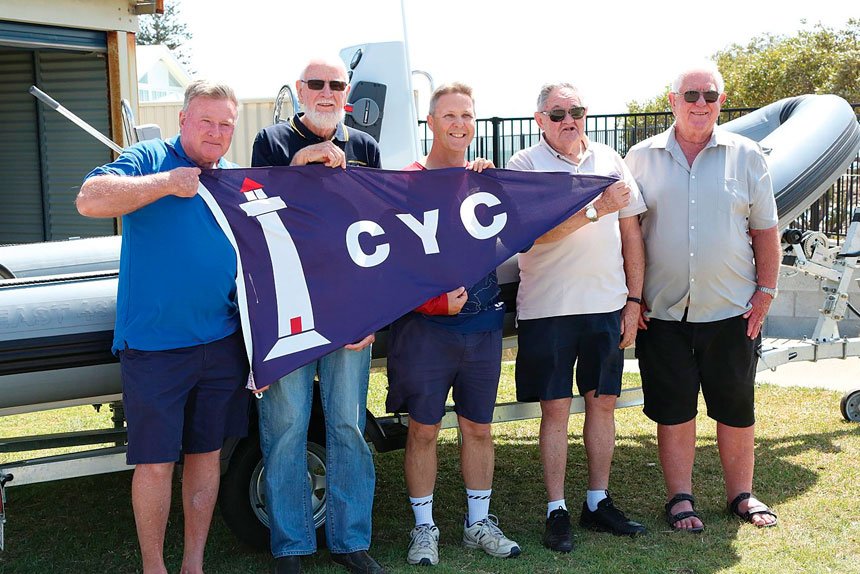 SUMMER ARRIVES: Lex Stanbridge, Brian Russell, Steve Lawie, Al Lacoste and Alan Cook launch the 2023 summer sailing season.