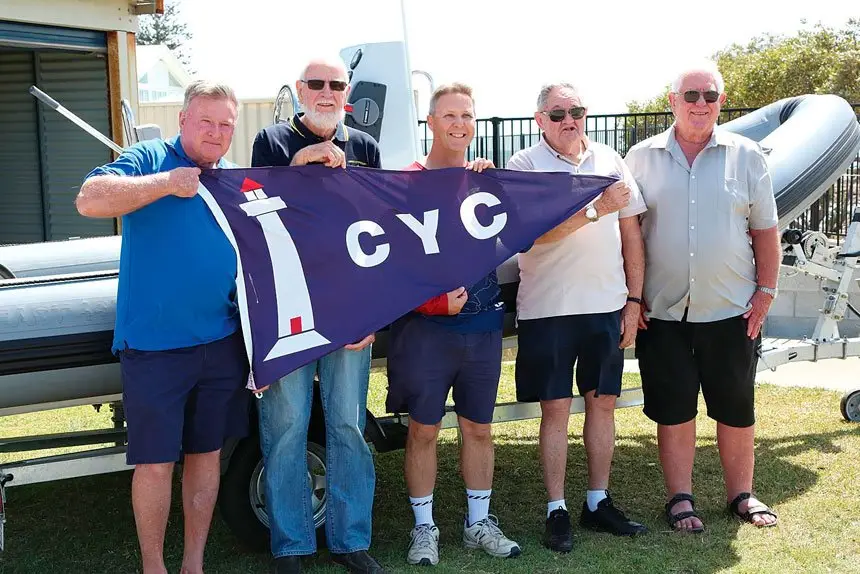 SUMMER ARRIVES: Lex Stanbridge, Brian Russell, Steve Lawie, Al Lacoste and Alan Cook launch the 2023 summer sailing season.