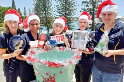 Members of the STAR team prepare for its annual Secret Santa drive.
