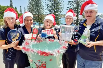 Members of the STAR team prepare for its annual Secret Santa drive.