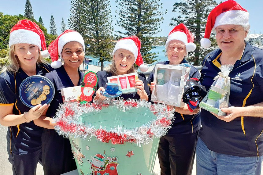 Members of the STAR team prepare for its annual Secret Santa drive.
