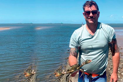 Tim Simmonds with a slightly undersize, male, mud crab he caught and released at Wynnum this week