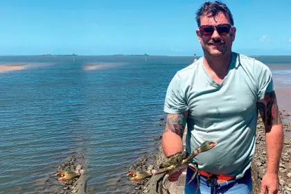 Tim Simmonds with a slightly undersize, male, mud crab he caught and released at Wynnum this week