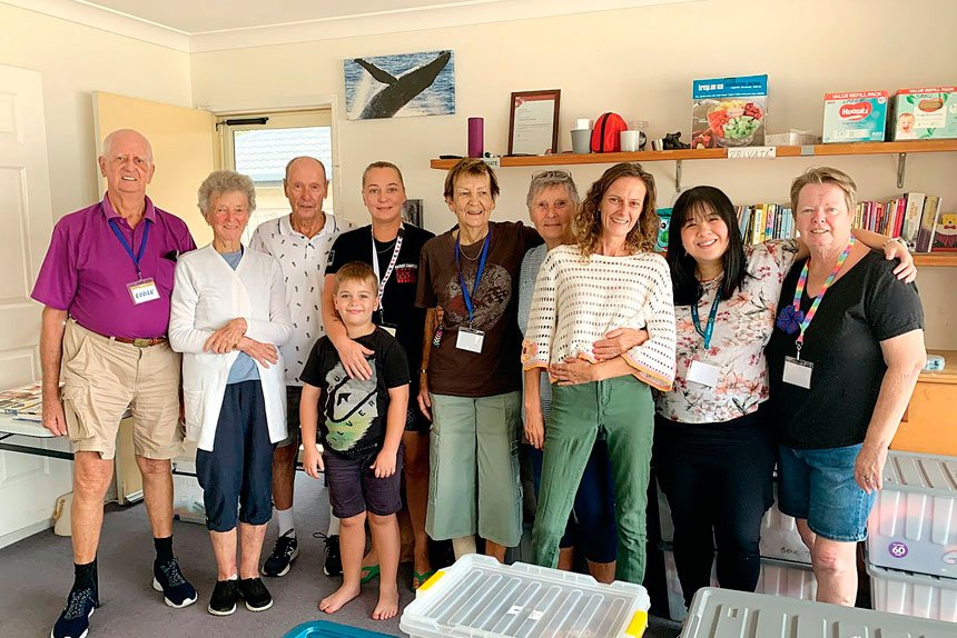 Narelle and Brian Jeffriess and volunteers celebrate continued charity service.