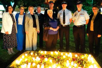 Residents unite for the candlelight vigil held for victims of domestic violence.