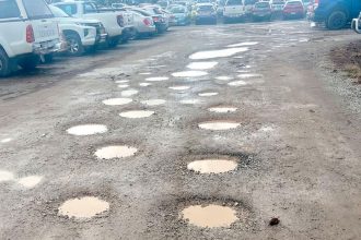 BUMPY RIDE: The carpark is dotted with potholes but Council says it has a plan to fix them.