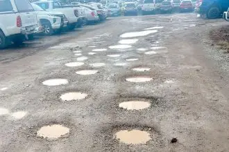 BUMPY RIDE: The carpark is dotted with potholes but Council says it has a plan to fix them.