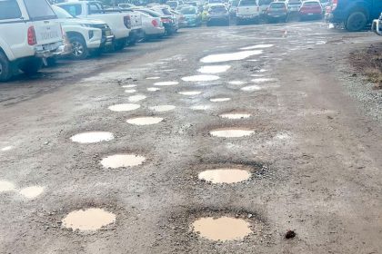 BUMPY RIDE: The carpark is dotted with potholes but Council says it has a plan to fix them.