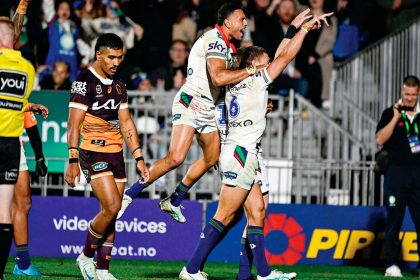 Warriors Freddy Lussick and Marcelo Montoya celebrate a try against the Broncos. PHOTO: AAP