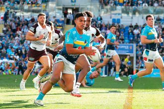 Keano Kini of the Gold Coast Titans in action during the NRL Round 22 match against the Brisbane Broncos. PHOTO: AAP Image/Jason O’Brien