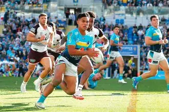 Keano Kini of the Gold Coast Titans in action during the NRL Round 22 match against the Brisbane Broncos. PHOTO: AAP Image/Jason O’Brien