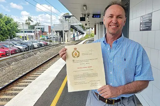 Proudest Moment: Queensland Rail employee Brad Moore was recognised for his bravery by Queen Elizabeth II.