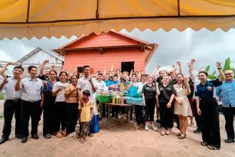 BUILDING FRIENDSHIPS: The Industry School students helped to build a home for a Cambodian family.