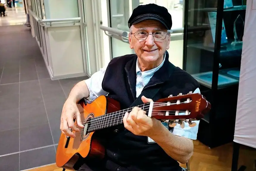 Costa Cristy spends two mornings a week playing Spanish guitar at the Redland Hospital and Residential Care facility as a way of giving back during his retirement.