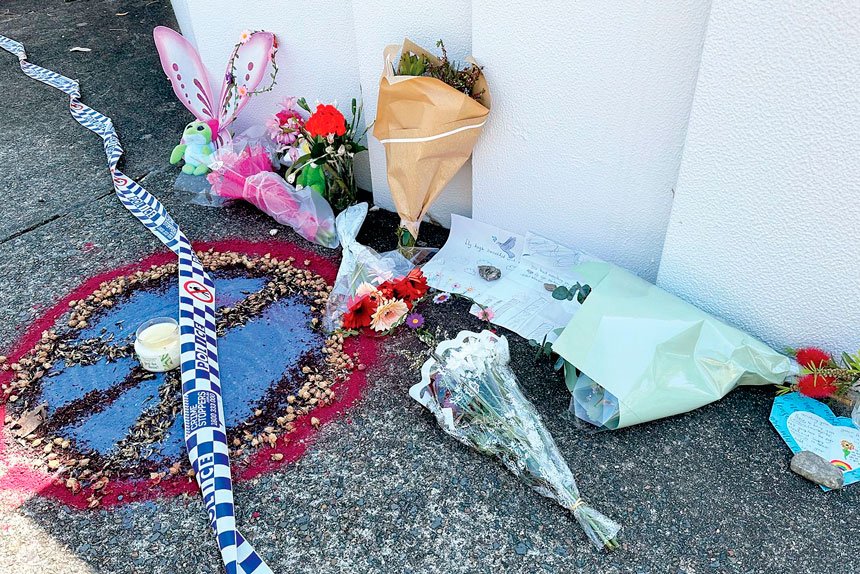 Flowers, cards and toys were left outside the Thorneside home where a girl and her babysitter died PHOTO: Savannah Meacham/AAP