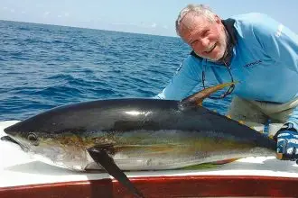 Norm Haupt with a yellow fin tuna caught when fishing in Panama.