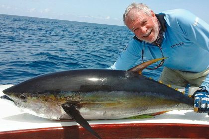 Norm Haupt with a yellow fin tuna caught when fishing in Panama.