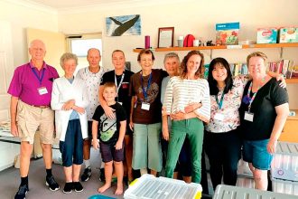 Narelle and Brian Jeffriess and volunteers celebrate winning the Commonwealth Bank Community Donations program.