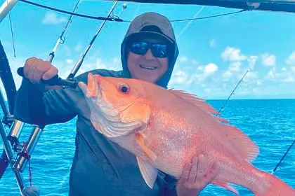 Peter Stanley with a large mouth Nannygai fish. He said he had experienced many proud fishing moments.