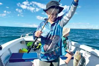 Simon Bubbers says constant baiting and untangling will pay off for his sons Jedd and Bodie who are developing a love of fishing.