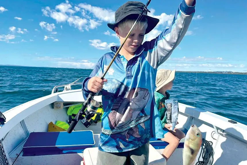 Simon Bubbers says constant baiting and untangling will pay off for his sons Jedd and Bodie who are developing a love of fishing.