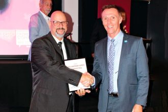 2024 Volunteer of the Year Robert Plummer with Crime Stoppers QLD CEO David Hansen