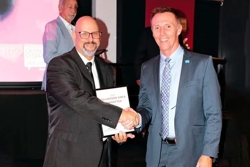 2024 Volunteer of the Year Robert Plummer with Crime Stoppers QLD CEO David Hansen